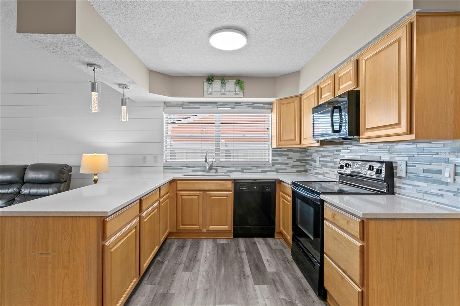 Kitchen features pendant lighting