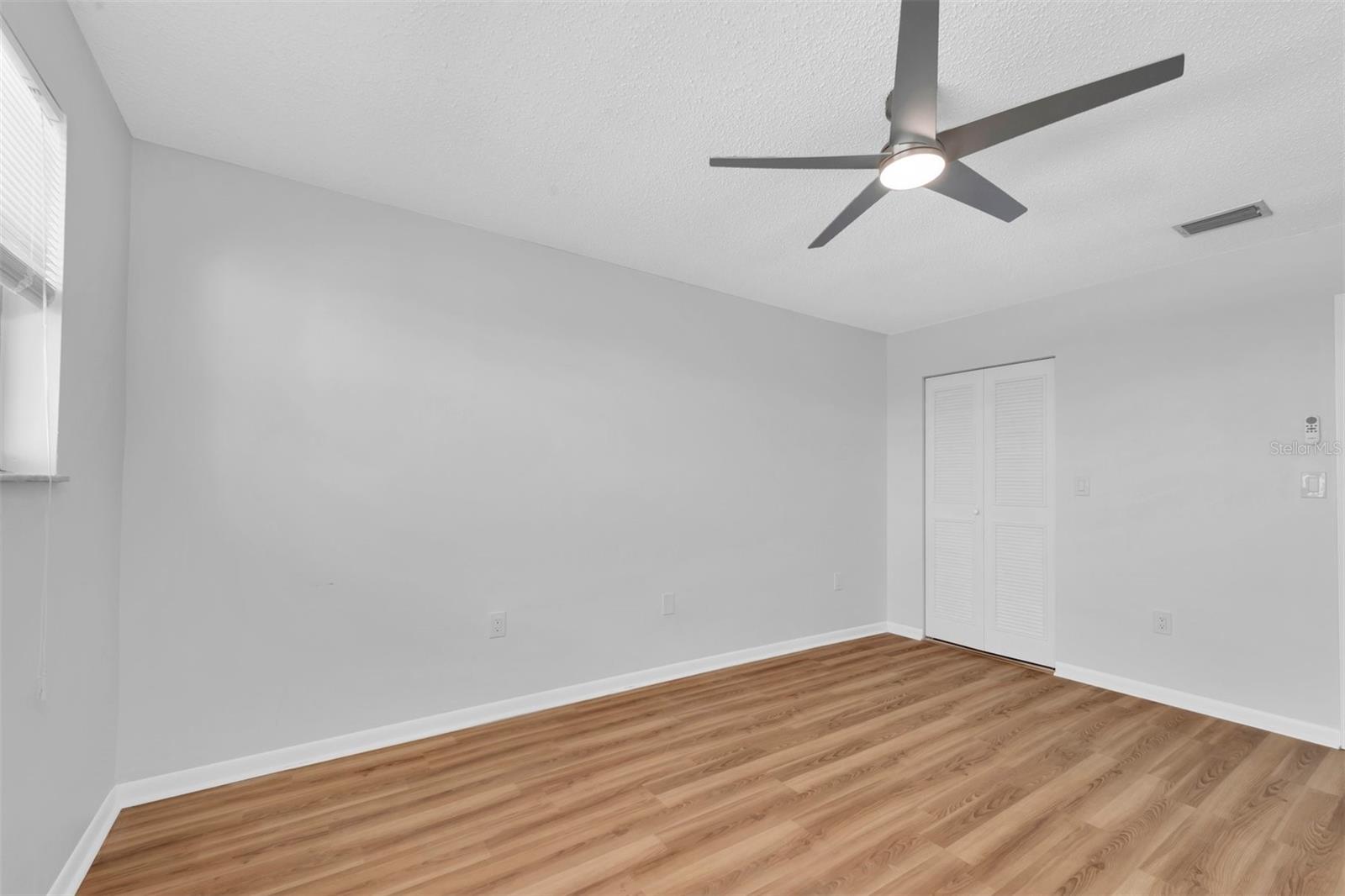 BEDROOM WITH WALK IN CLOSET