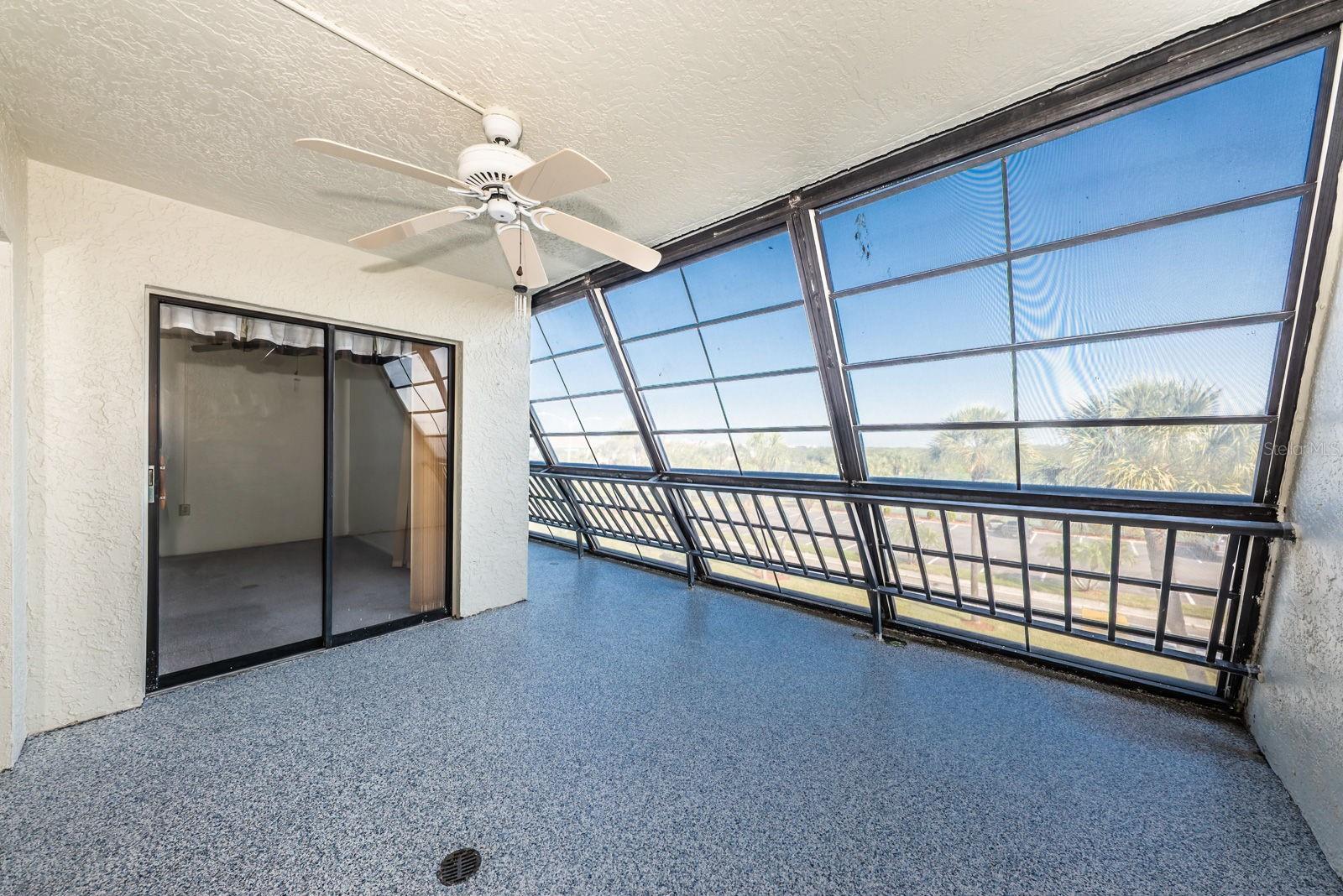 Balcony, primary bedroom slider doors to balcony