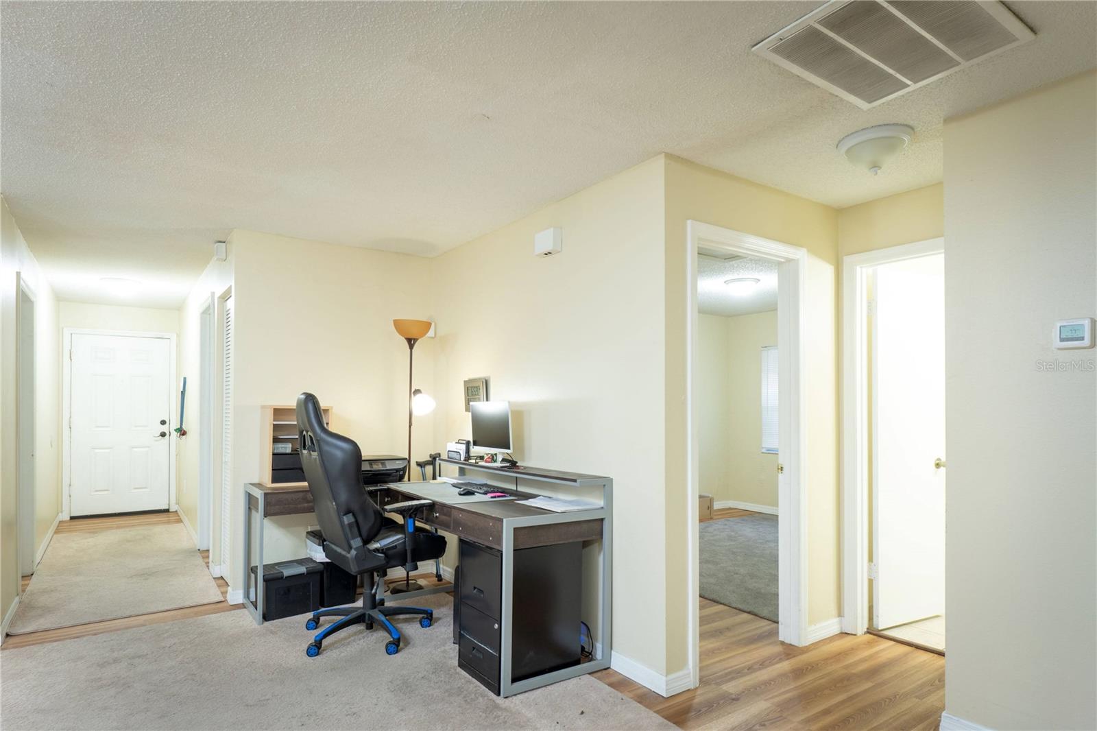 Living Room - View of Front Door in Rear of Photo