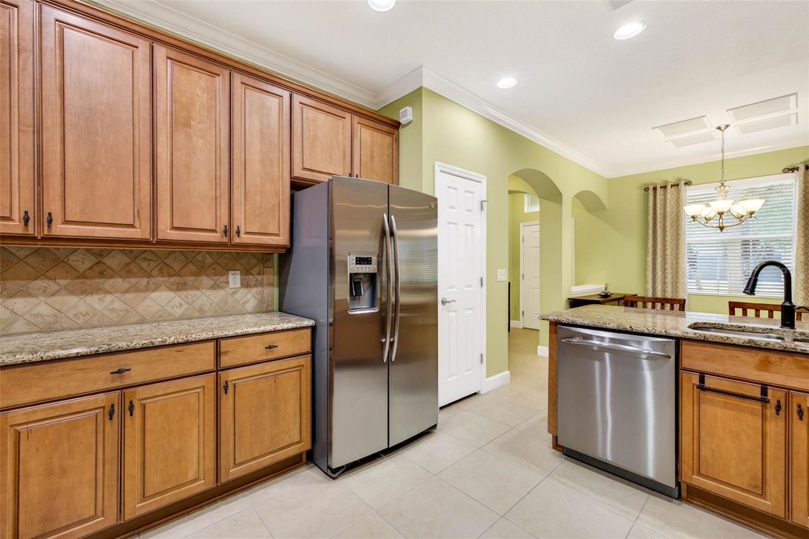 42" cabinets with granite countertops and stainless steel appliances.