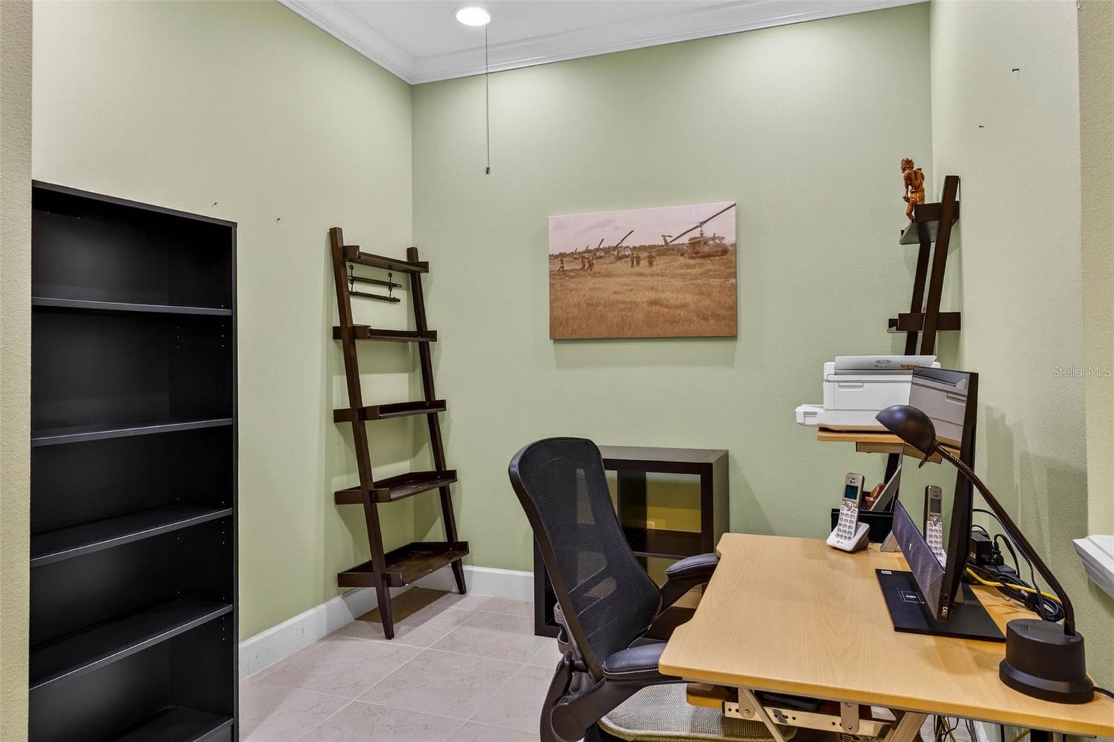 Office/Den with tile flooring and crown molding.