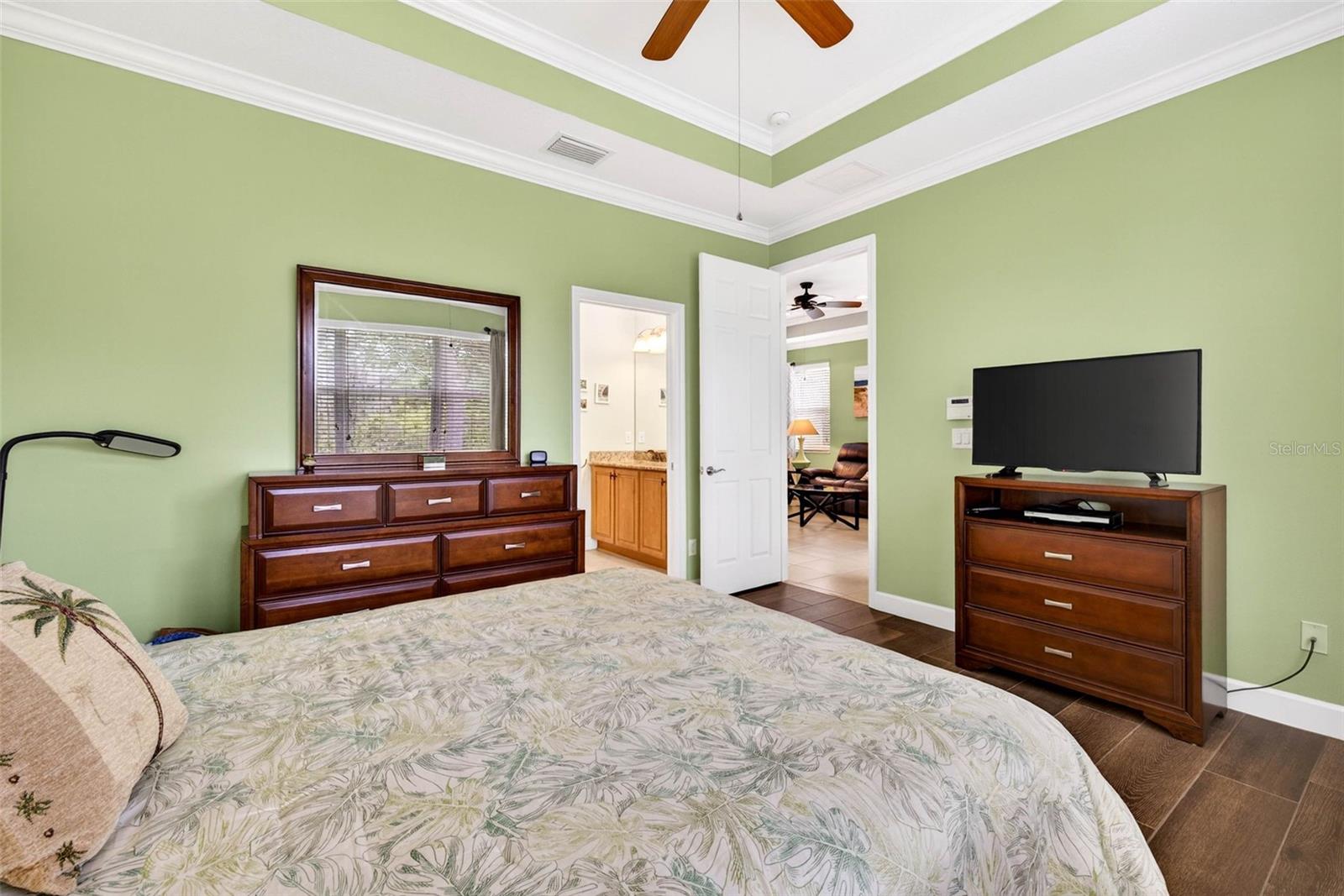 Primary bedroom with en suite bathroom and walk in closet