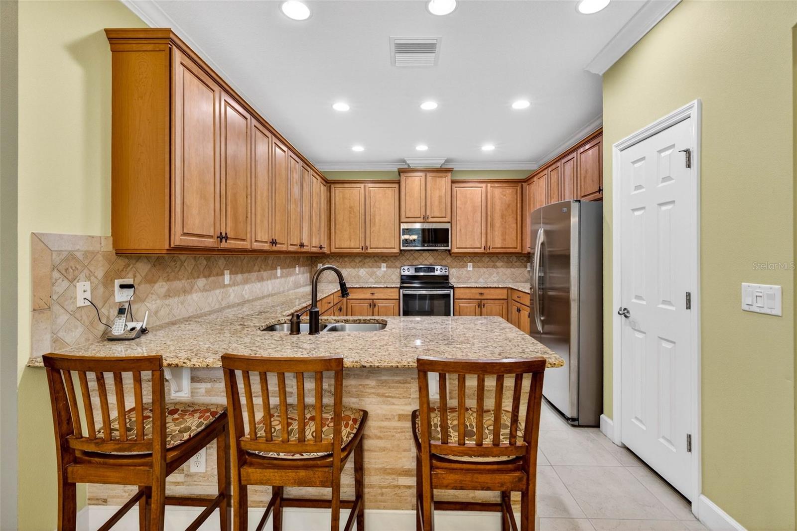 Breakfast bar, closet pantry, plenty of countertop space and cabinets.