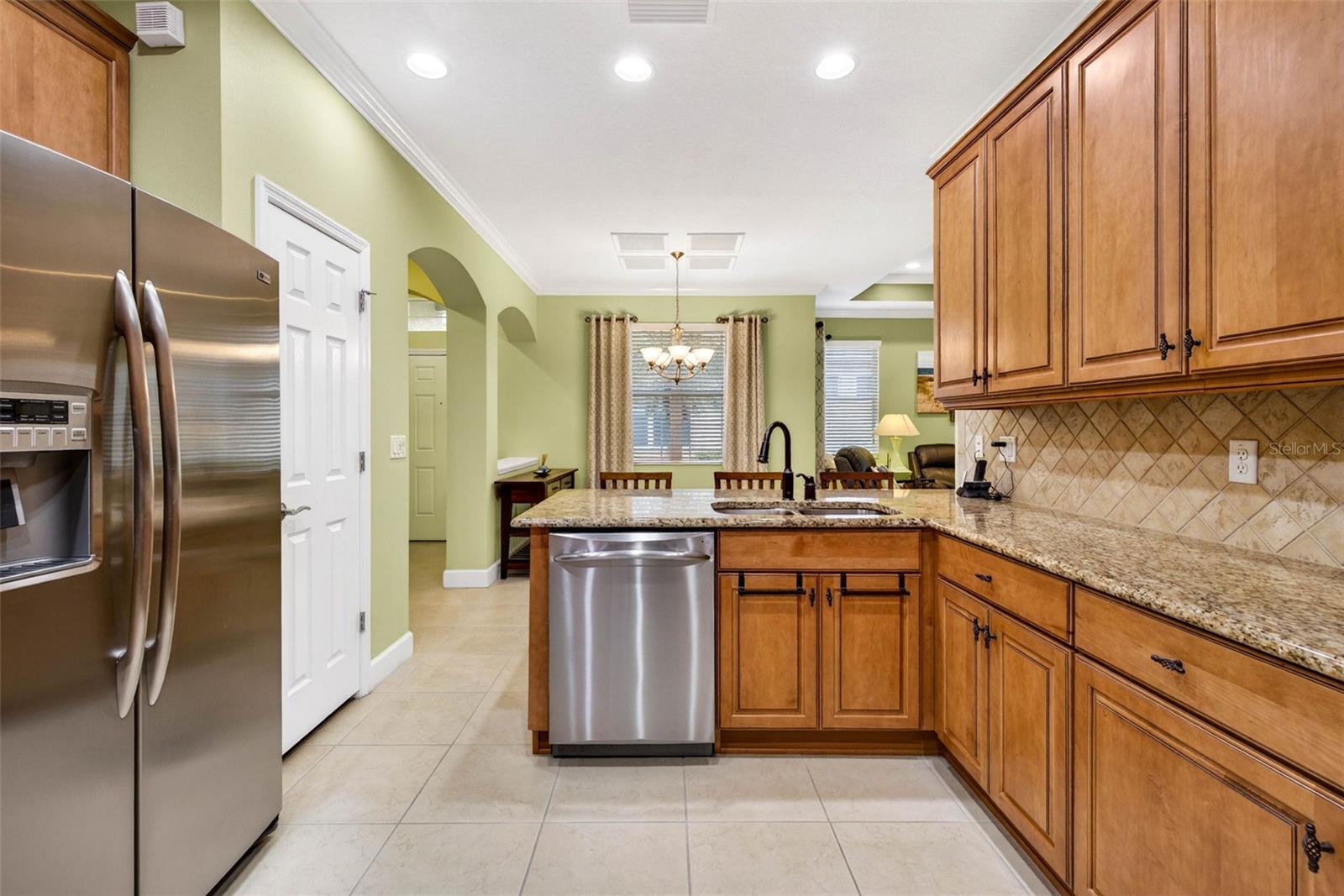 Stainless steel appliances. 42" decorative wood cabinets complete with hardware and tiled backsplash