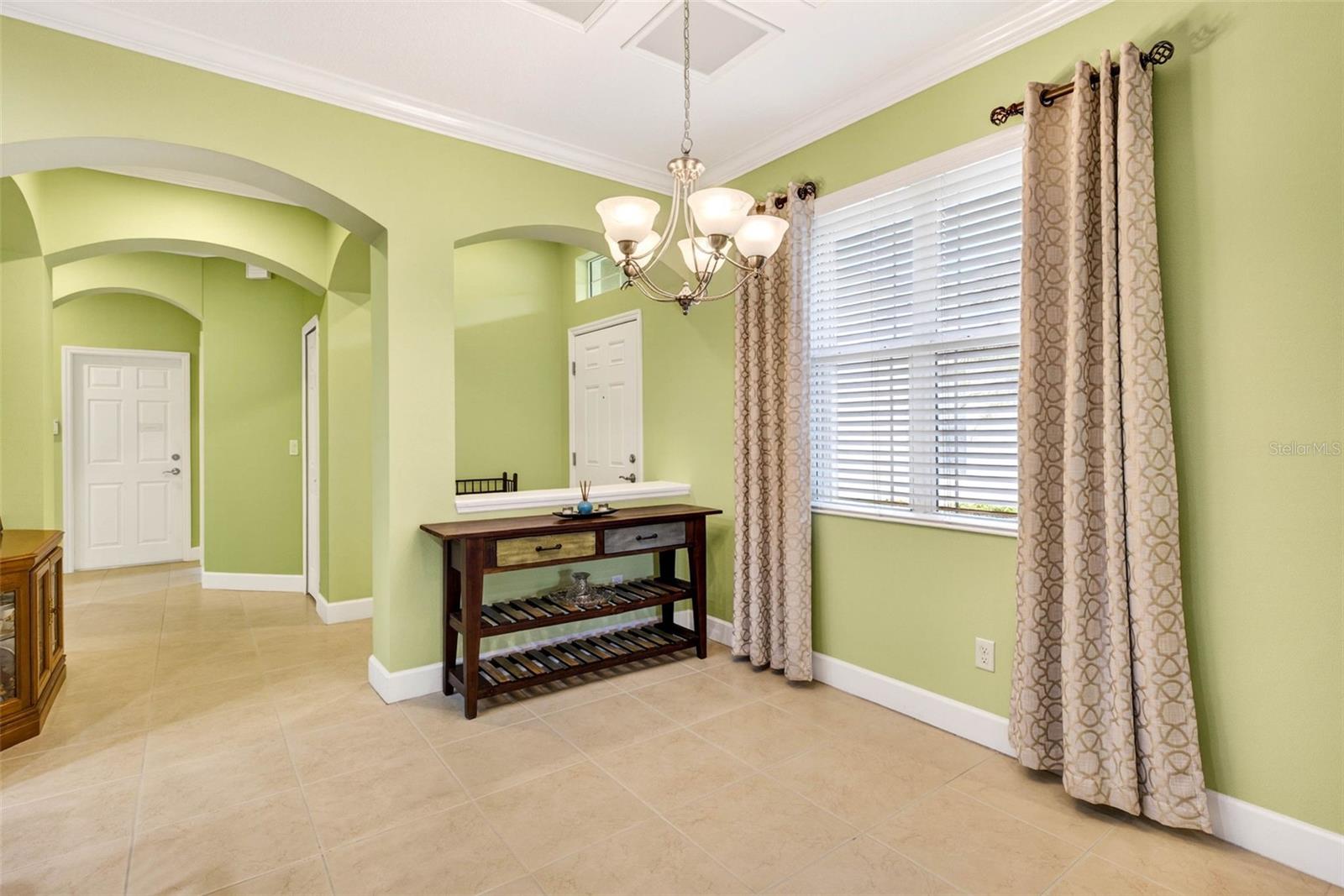 Dining room. Window treatments convey