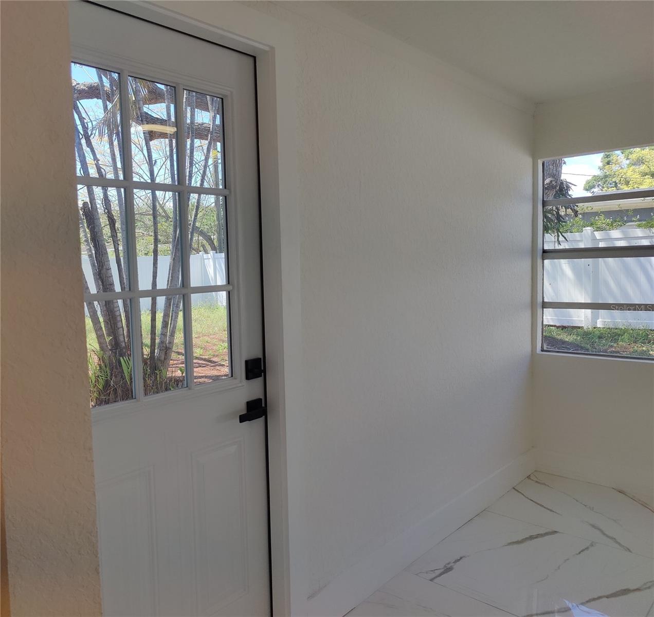 Office Room Door View into Backyard by A/C