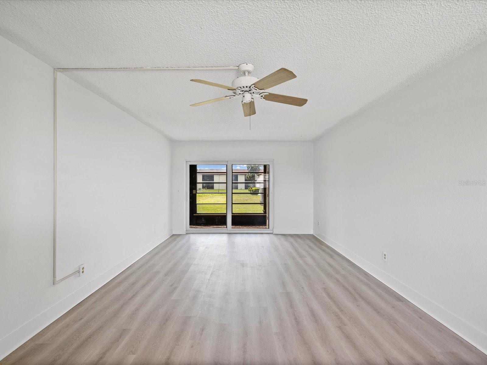 LIVING ROOM WITH NEW FLOORING