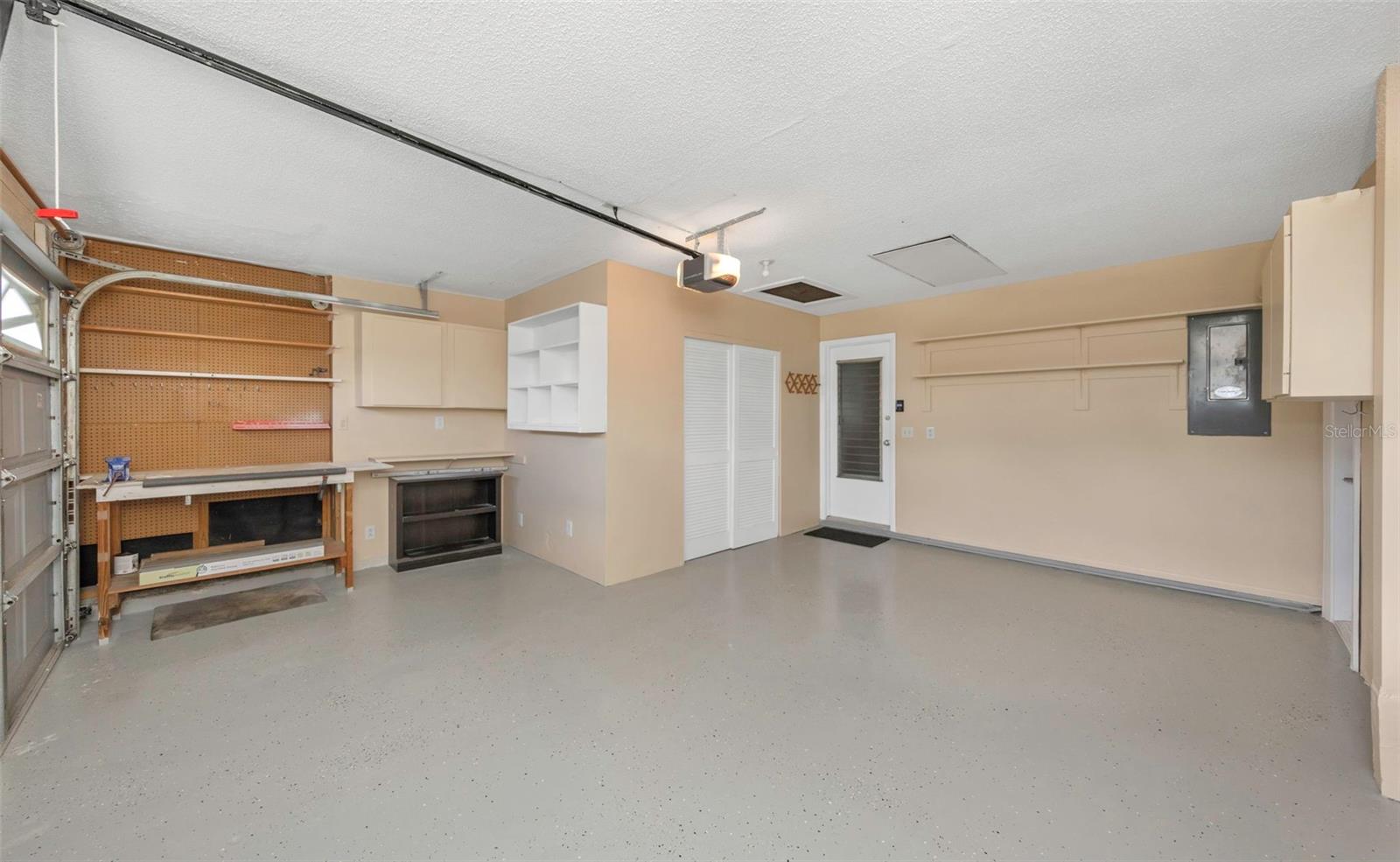 Freshly painted Garage and Floor with separate Laundry Room with Utility Sink