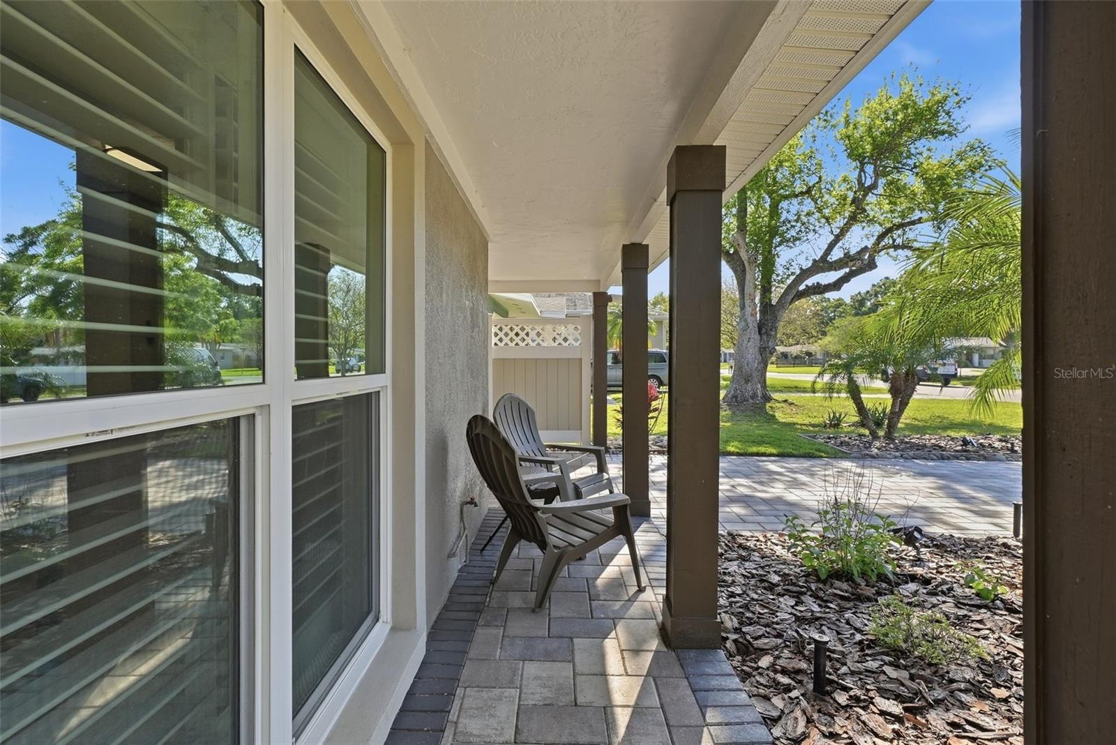 Front porch with hurricane rated windows.