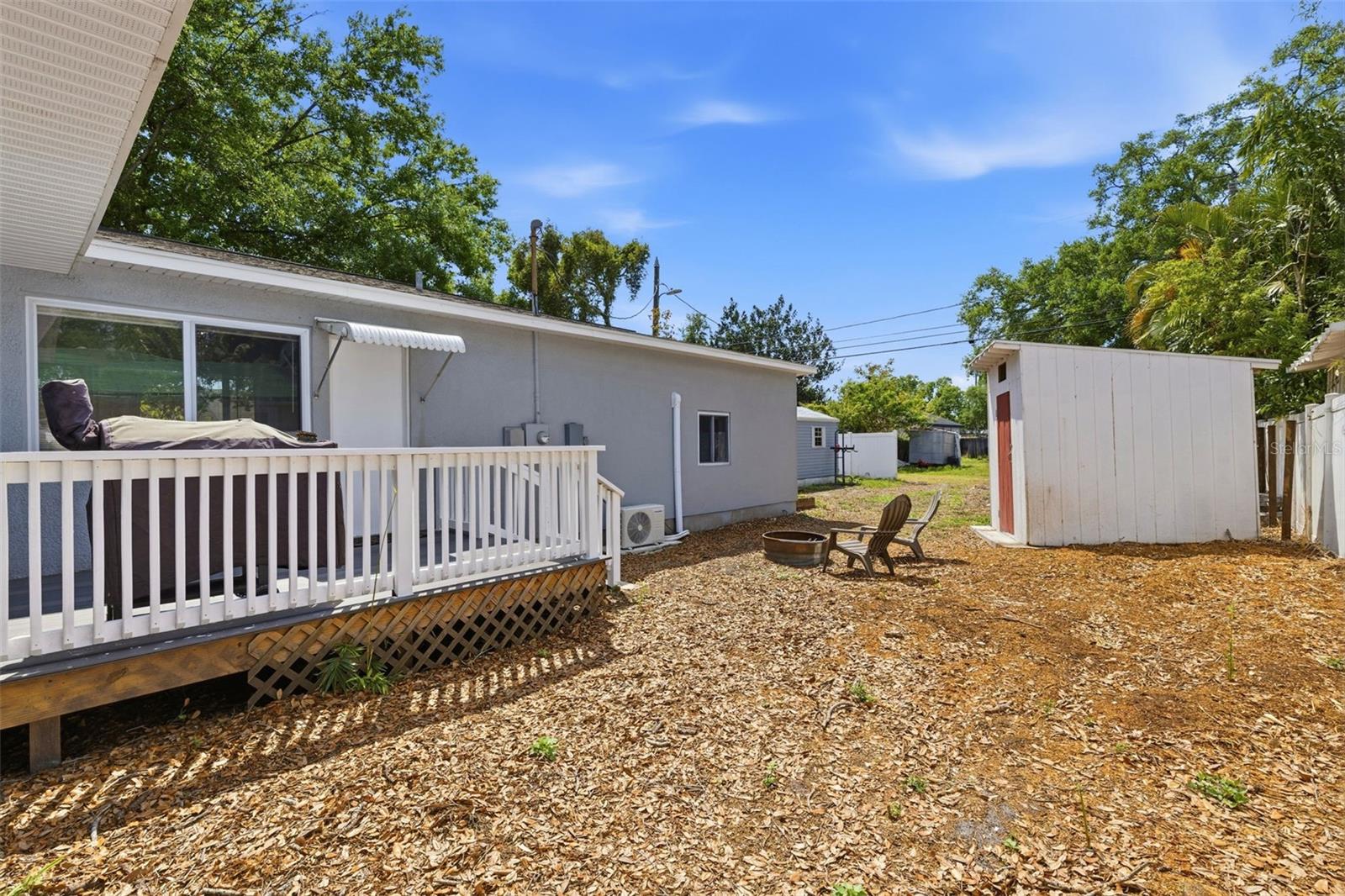 Fenced backyard with alley access