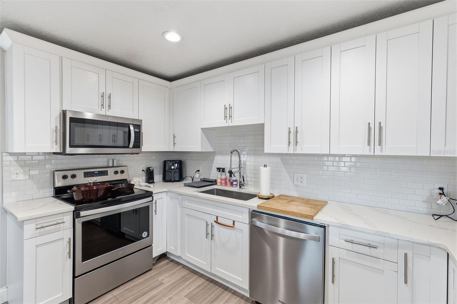 Kitchen with stainless steel appliances + storage