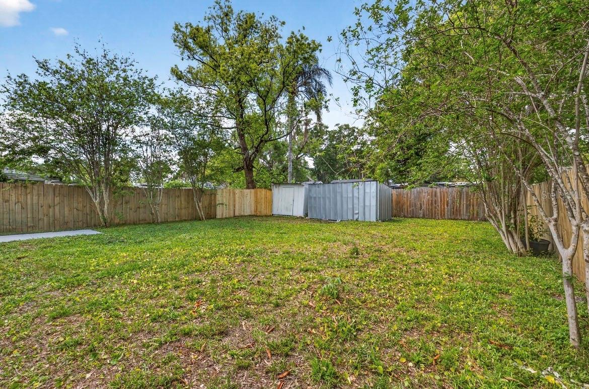 DEEP PRIVATE BACK YARD; FULLY FENCED; STORAGE SHED