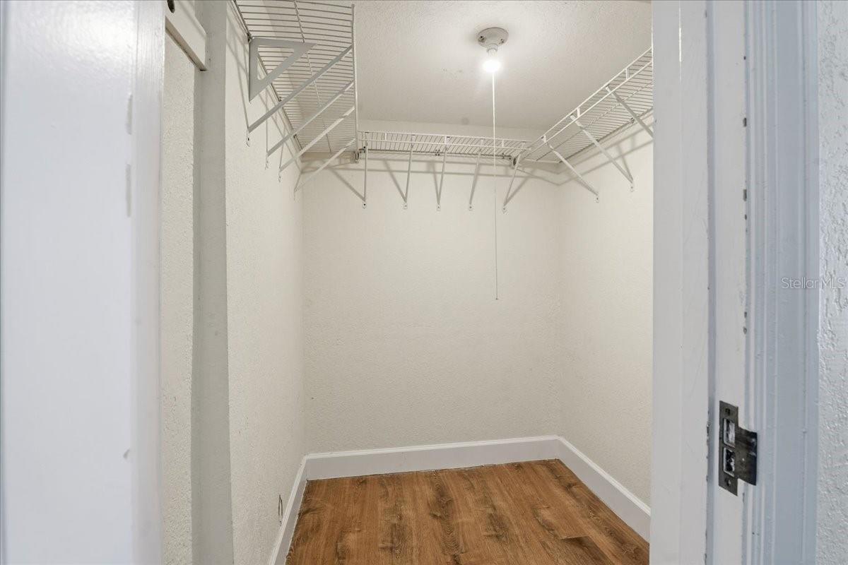 WALK IN CLOSET IN PRIMARY BEDROOM