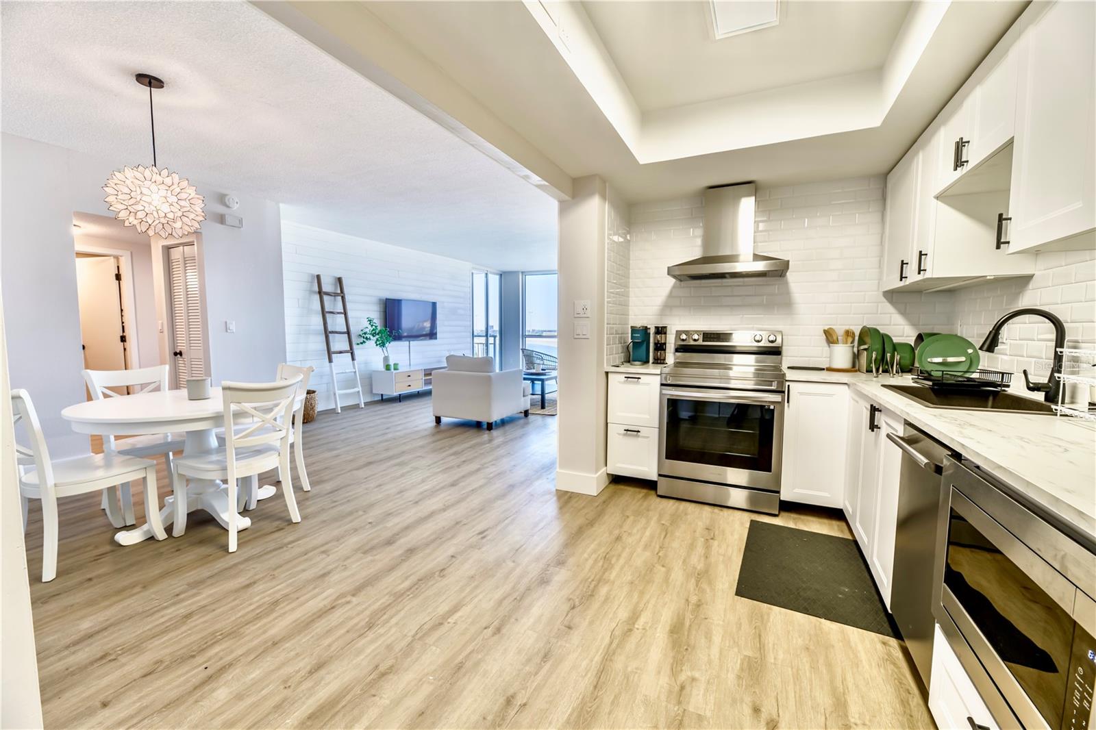 (Left to Right) Dining area, Hallway Primary Closet Door, Hallway to Primary Bedroom, Closet Kitchen Pantry, Living room, Kitchen Open Floor Concept