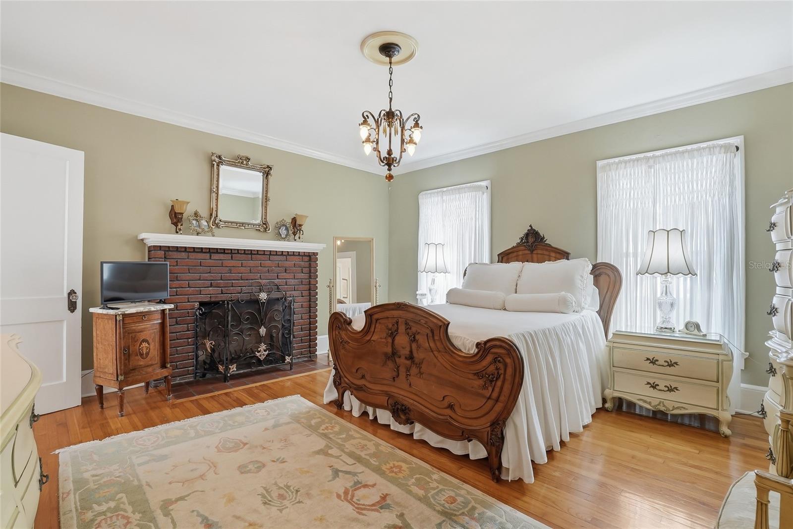 Primary Bedroom with view of Fireplace