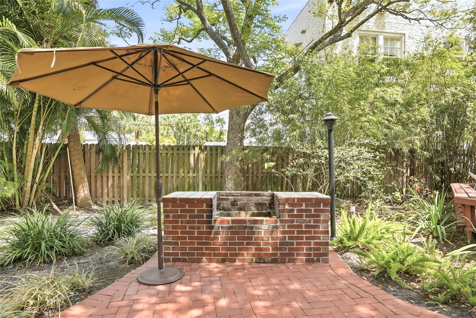 Backyard Brick Patio with view of Brick Grill