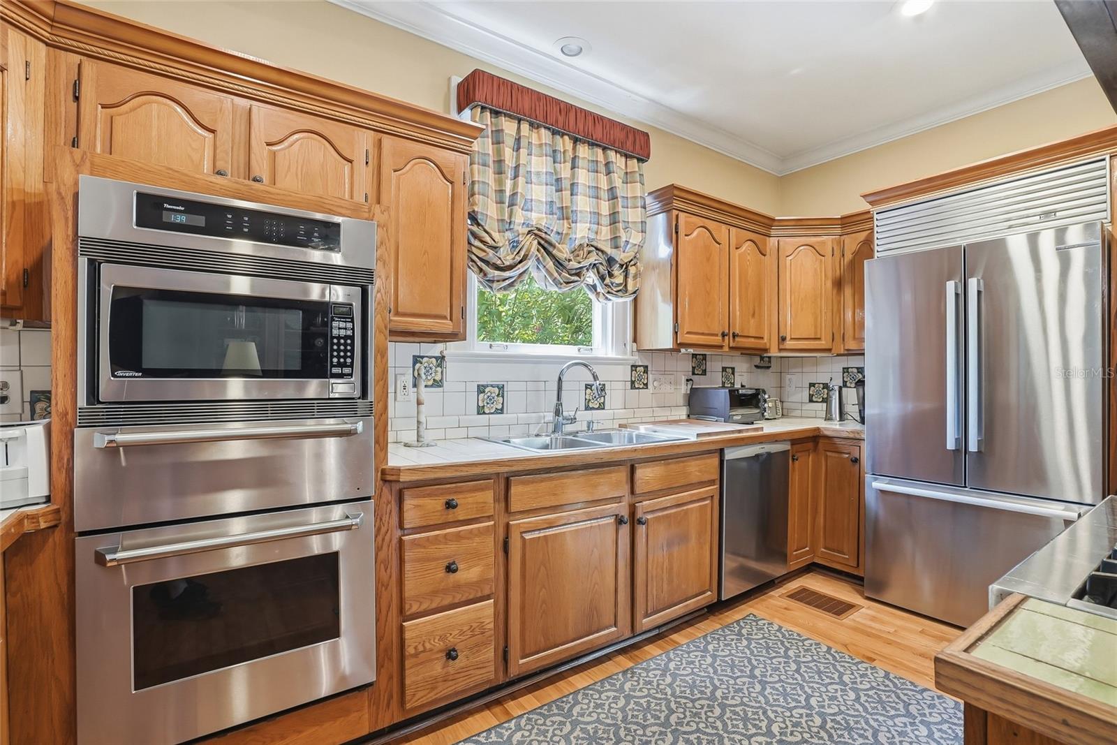 Kitchen with Ovens and Fridge