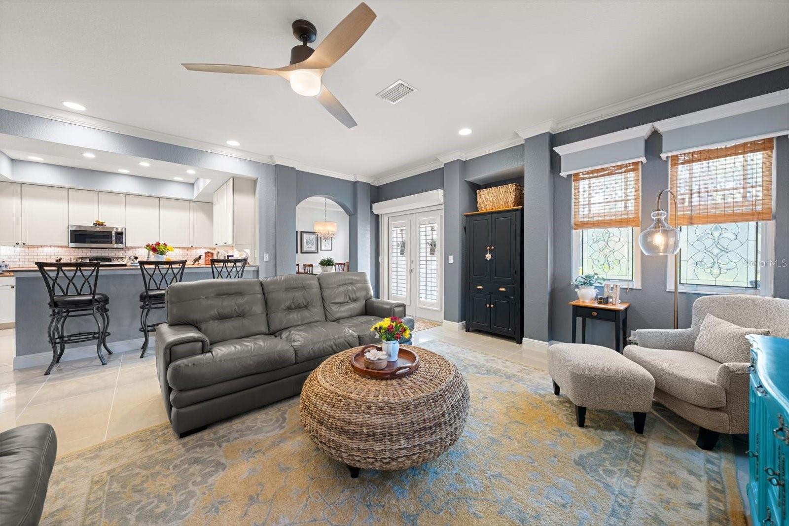 Living room, kitchen, french doors to front covered patio