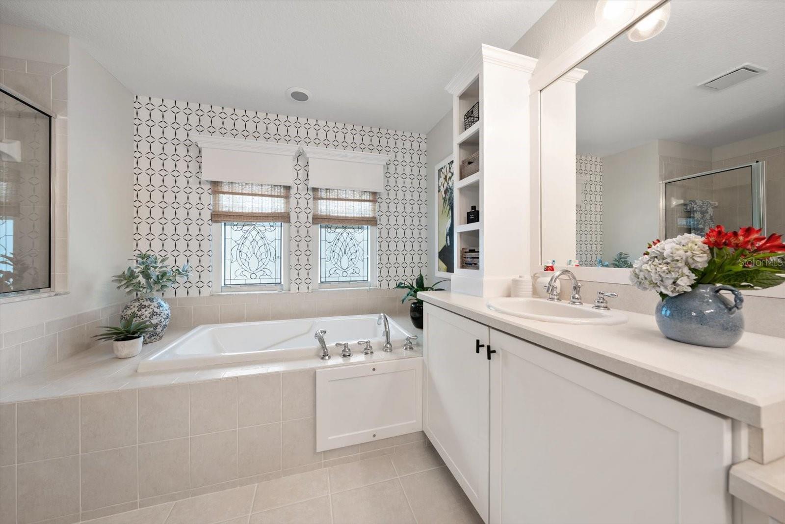 Primary en suite bath with dual sinks, and garden tub