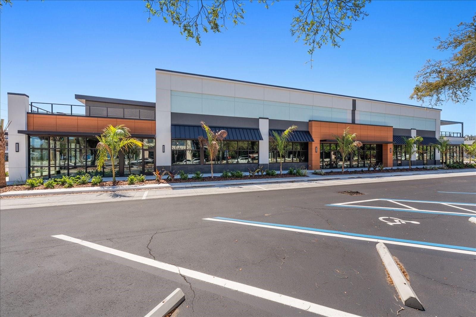 New Liberty Yards center with dining, rooftop bar, Fox Tail Coffee, and retail shops a short walk from unit