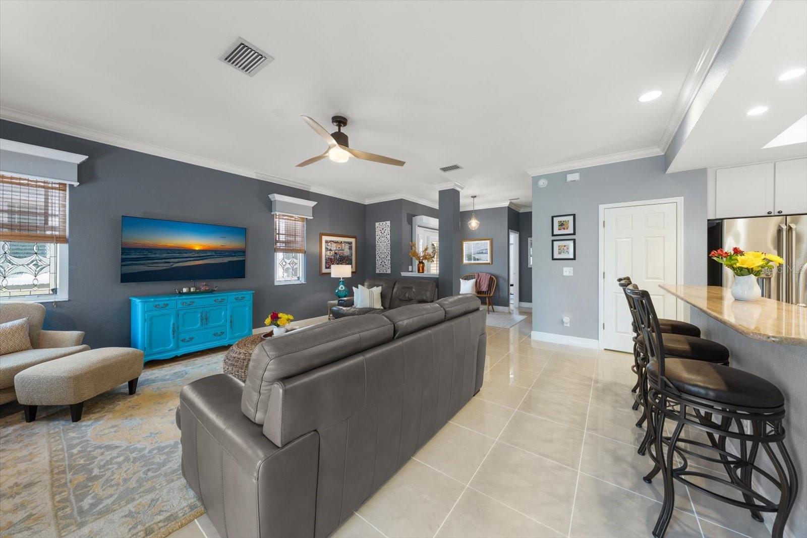 Living room, bar seating open to kitchen