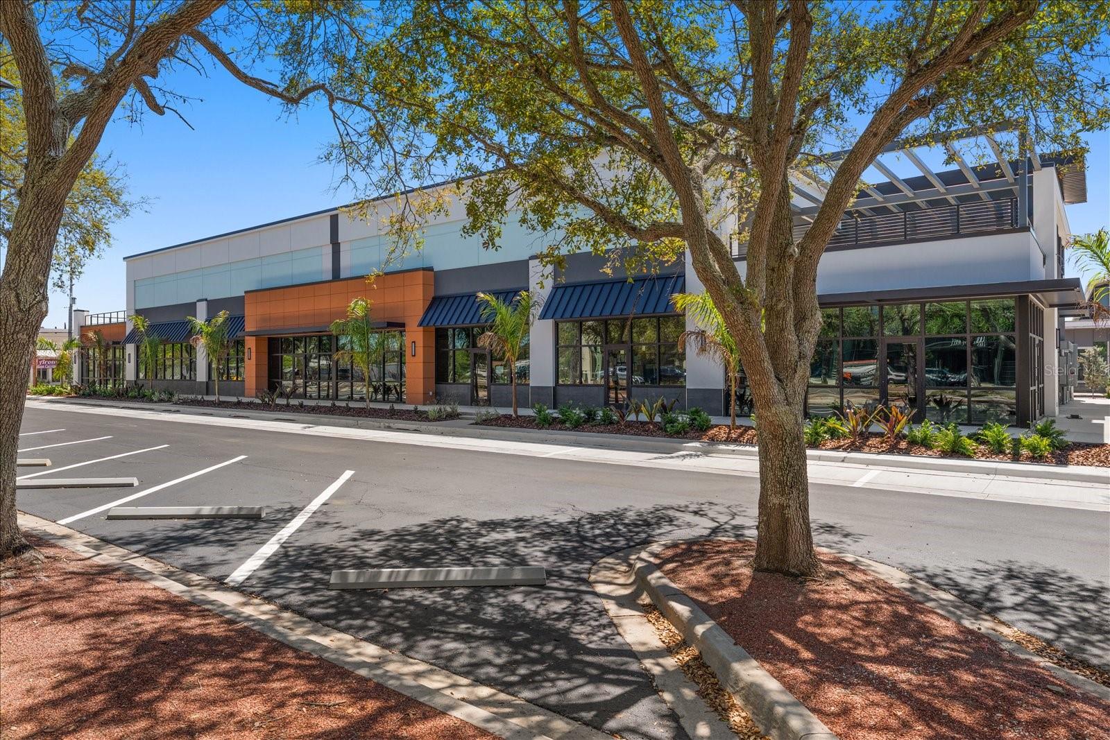 New Liberty Yards center with dining, rooftop bar, Fox Tail Coffee, and retail shops a short walk from unit