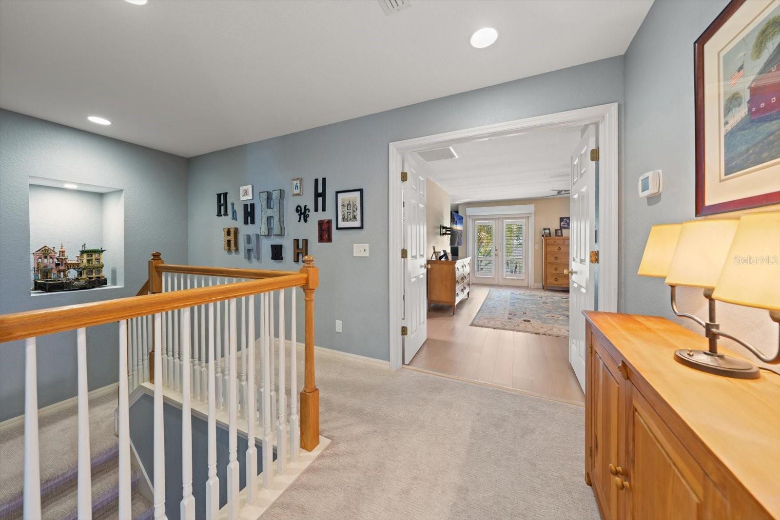 Upstairs landing, double door entry to primary suite
