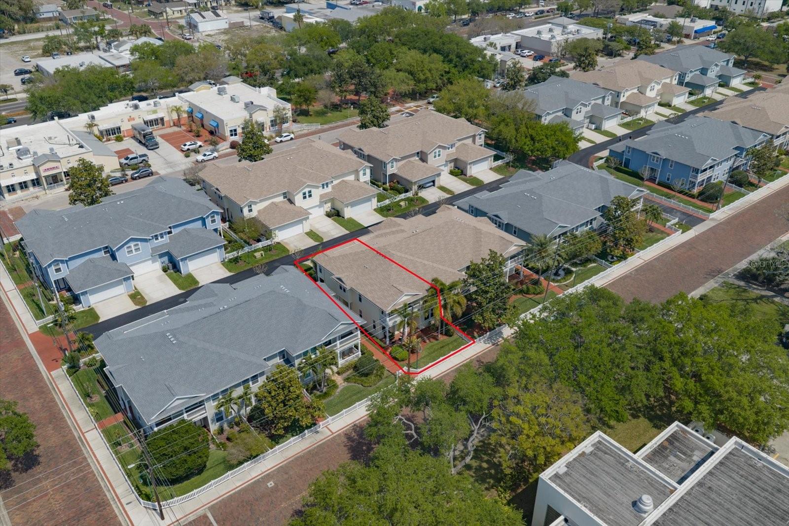 End unit aerial view, brick streets