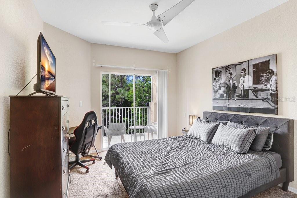 Primary Bedroom with entrance to balcony, walk in closet and ensuite bathroom