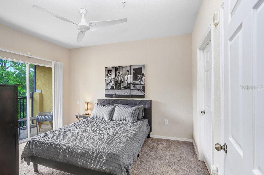 Primary Bedroom with entrance to balcony, walk in closet and ensuite bathroom