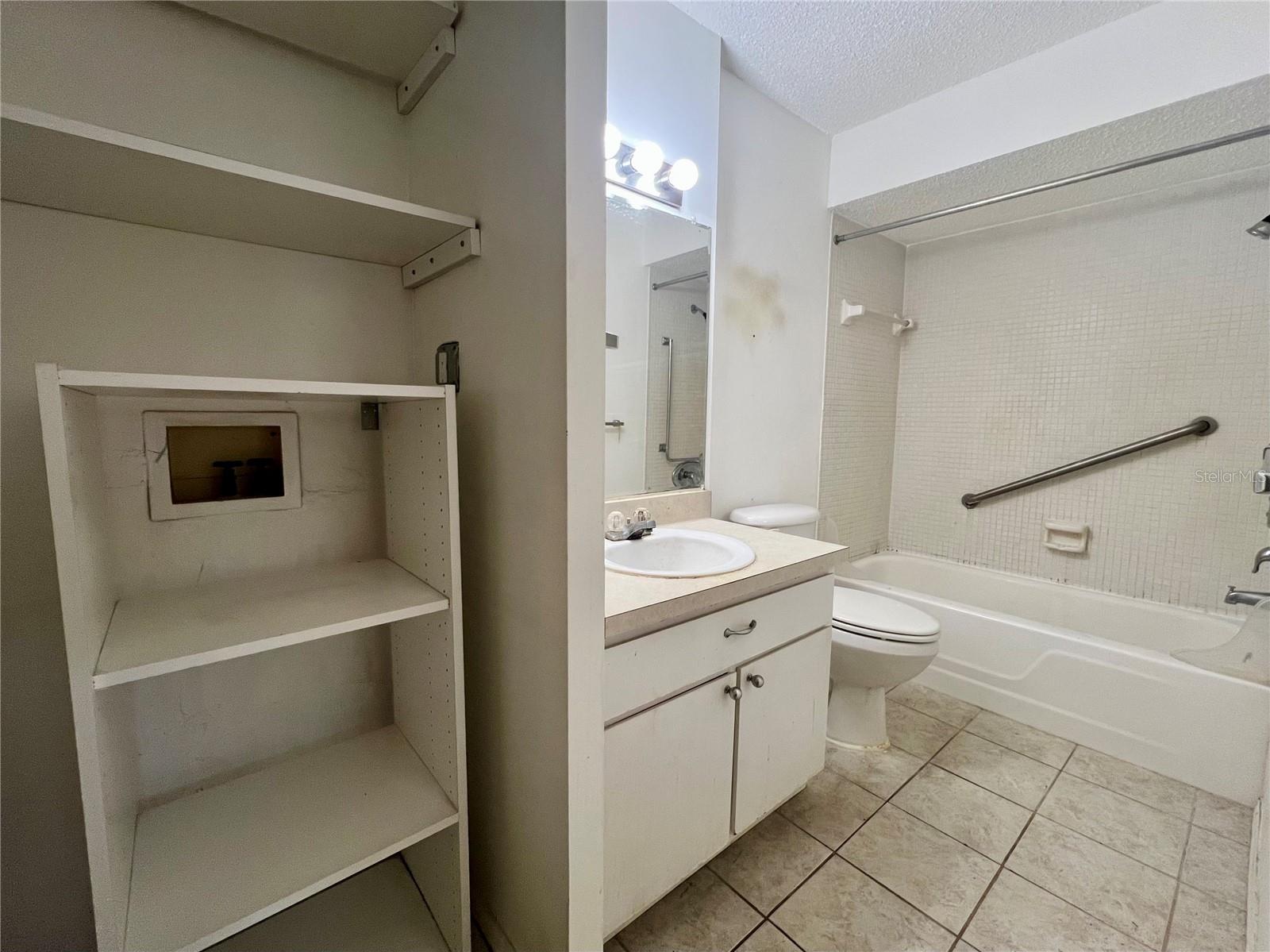 Bath with Plumbed Laundry Closet for Full Size Washer