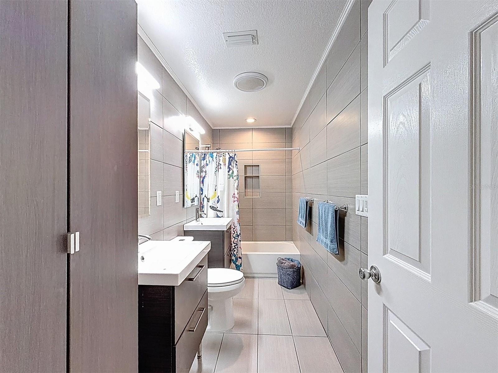 The primary bathroom is beautifully updated.