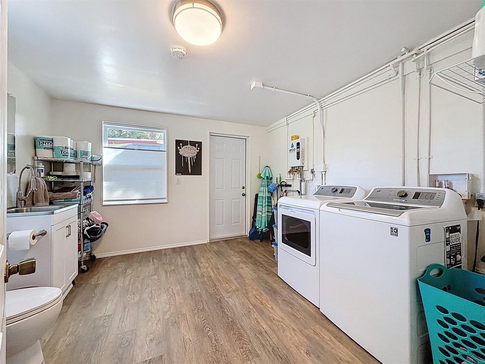The 2nd bathroom brilliantly doubles as a utility room and lots of space for laundry and storage.