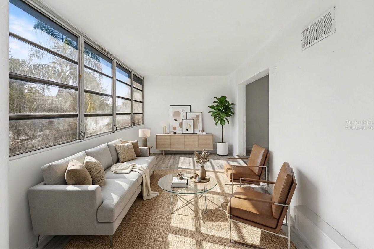 Virtually Staged- Flex room filled with natural light, can be used as an additional living room, a reading area, an office or a hobby space