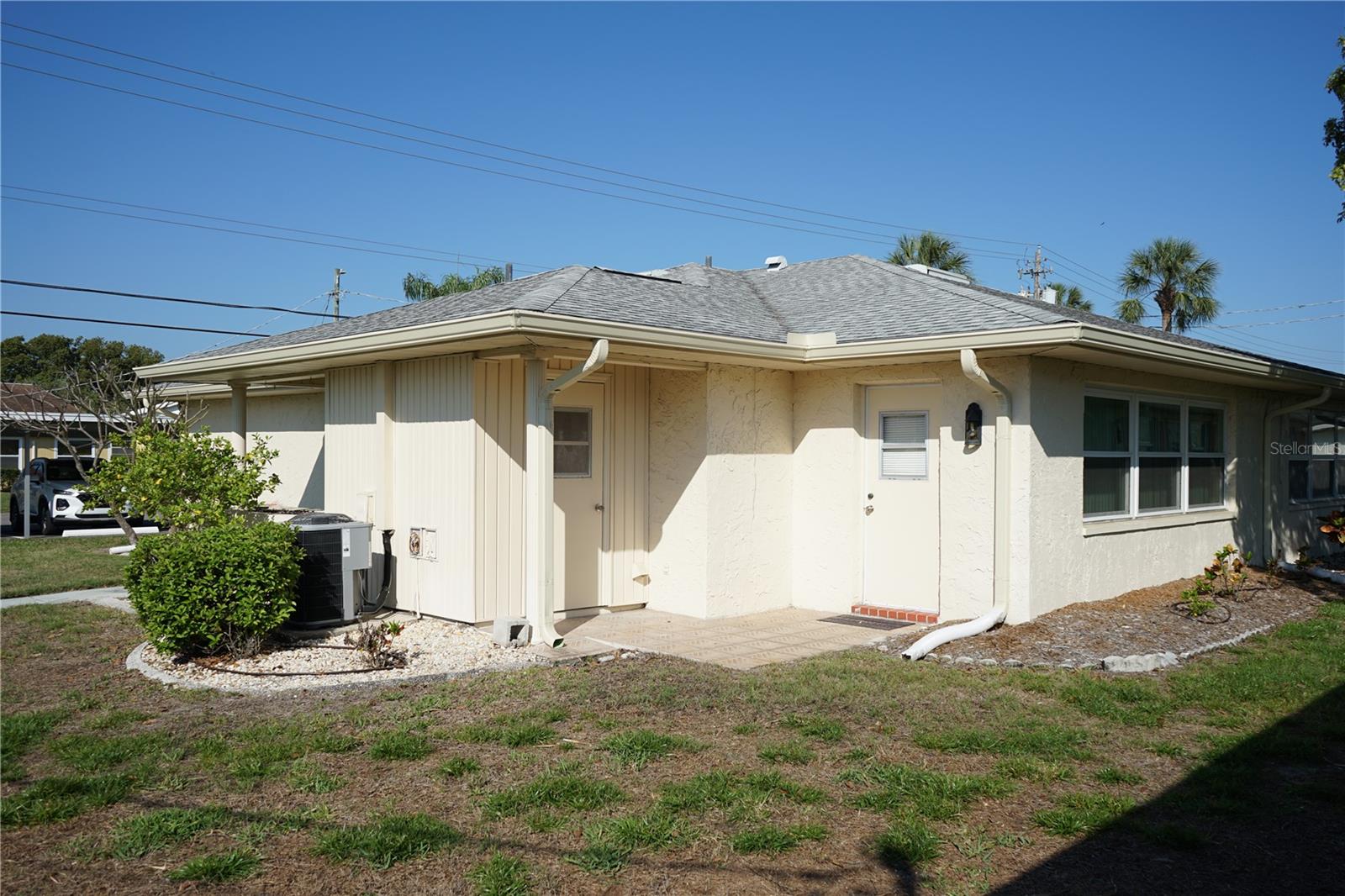 back door, golf cart parking pad and launry room access