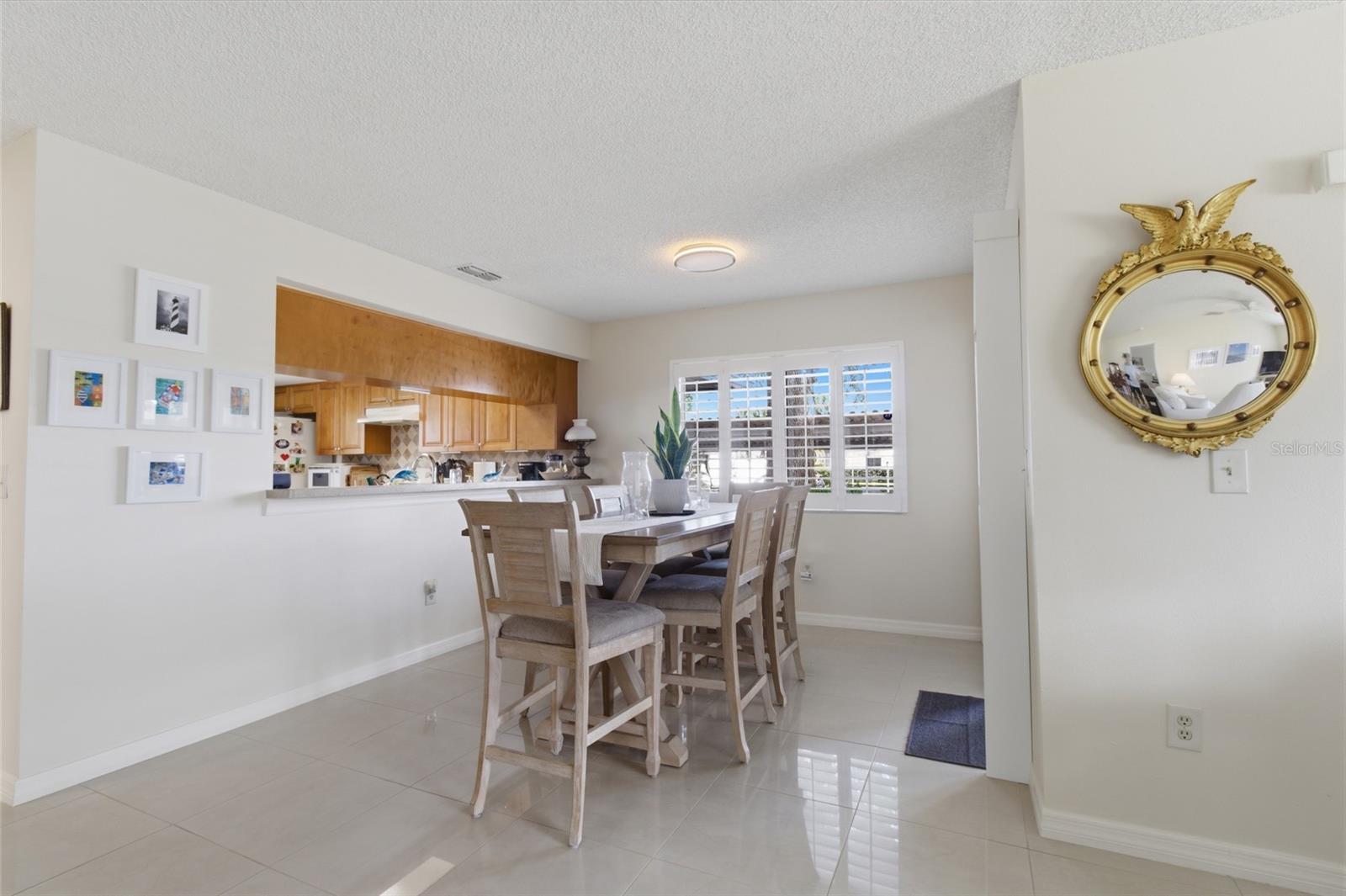 Dining Room with Sliders to front enclosed Patio
