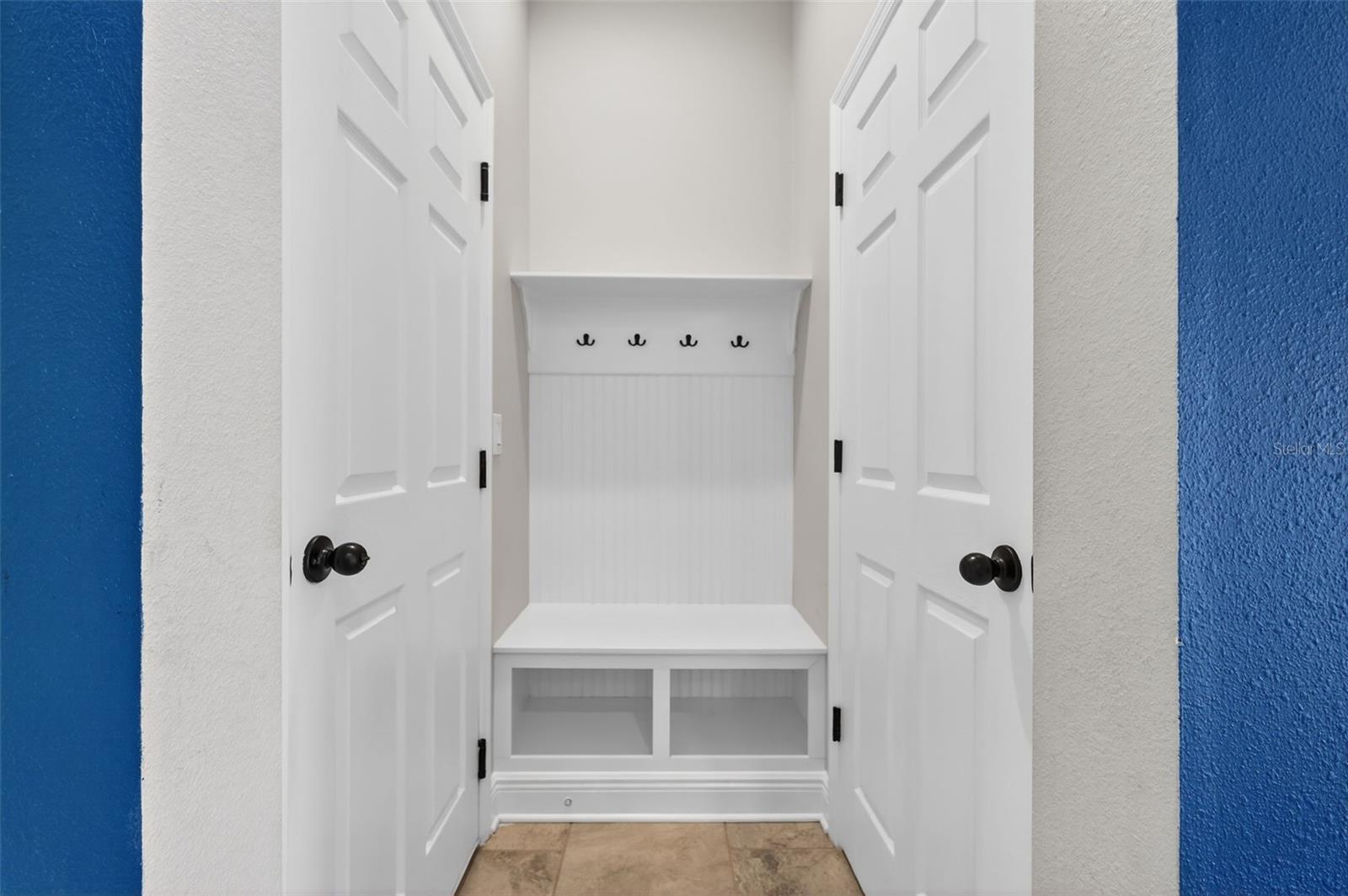 View of "Drop Zone" for Coats & Shoes - Garage on Left and Large Storage Closet or 2nd Pantry on Right