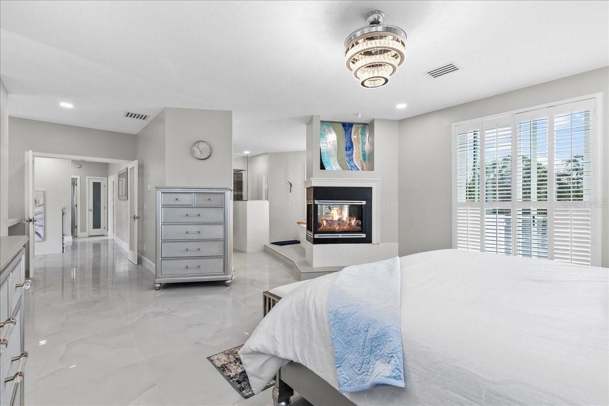 Gas triple sided fireplace in primary suite