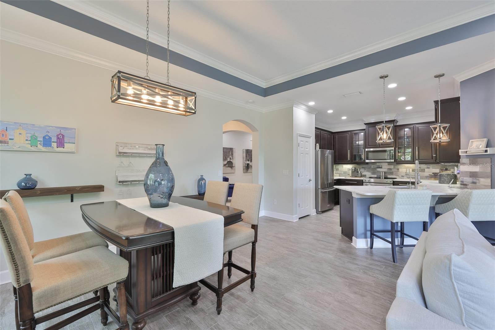 The dining area is a perfect size, just off of the kitchen for convenience.