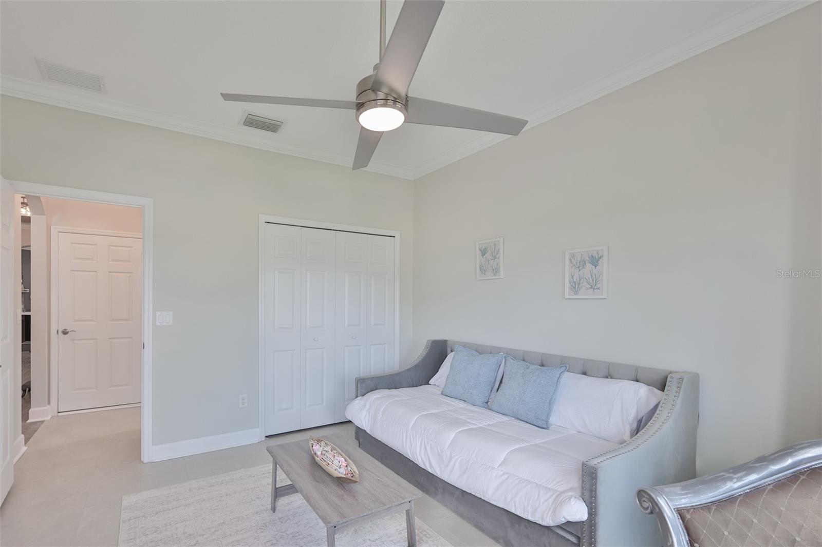 Crown molding, 5" base boards and contemporary lighting continue the theme throughout the shome.