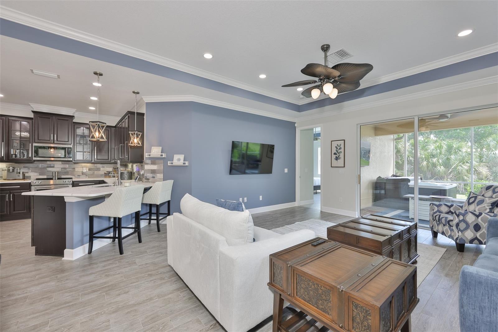 An open and welcoming floor plan with modern color palette is refreshing and bright.