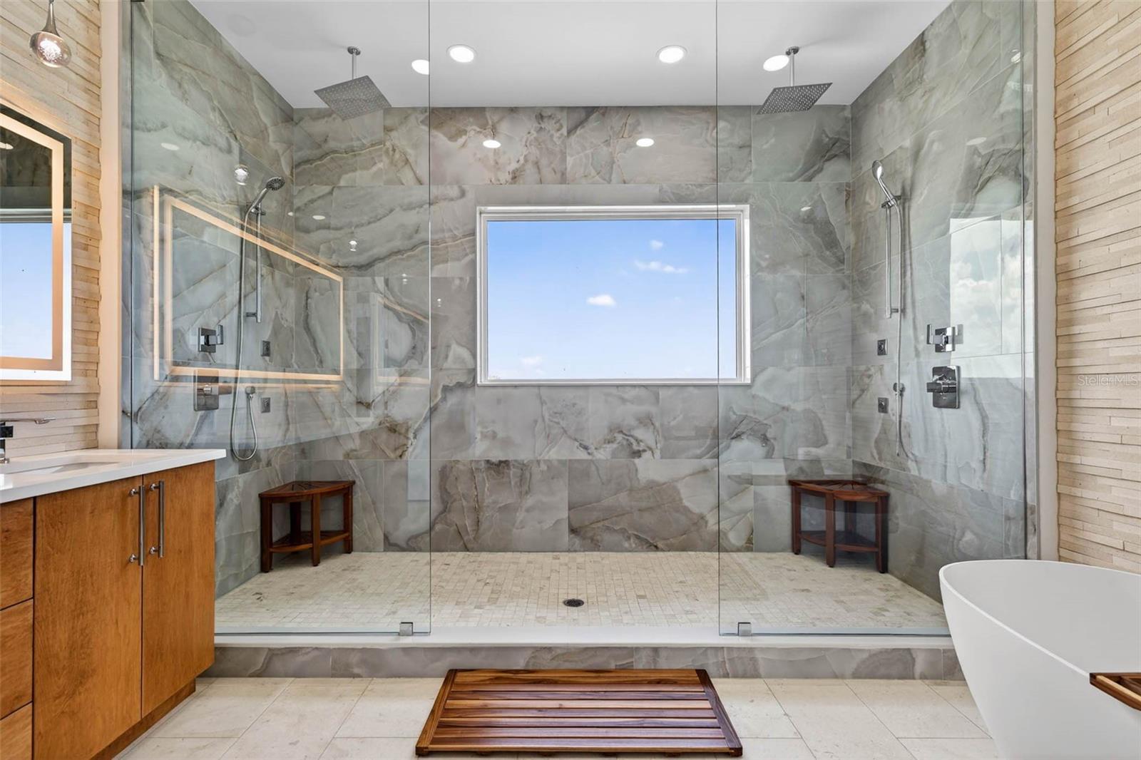 Dual shower with water views.