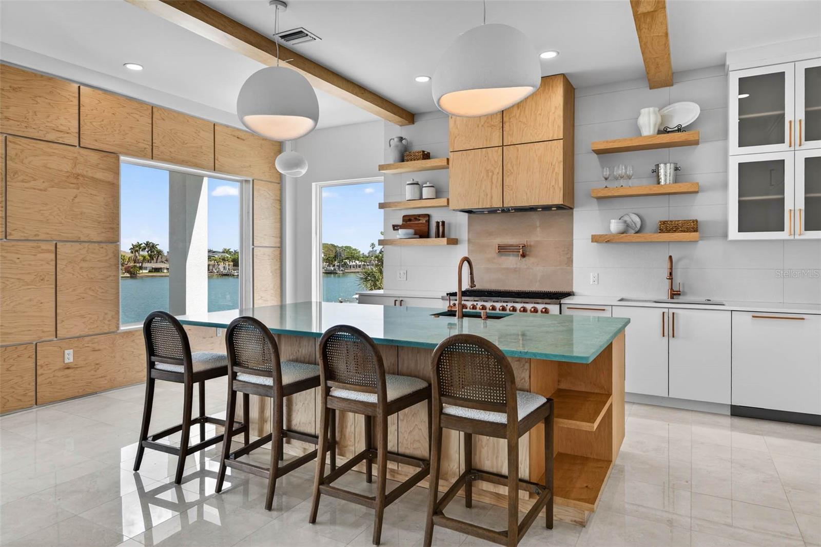 Open concept kitchen with high end appliances.