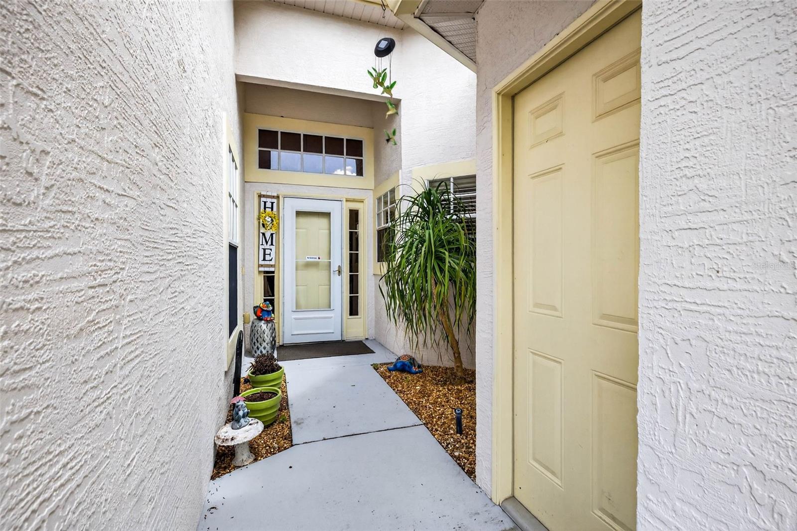 View of Front Door and Side Garage Door