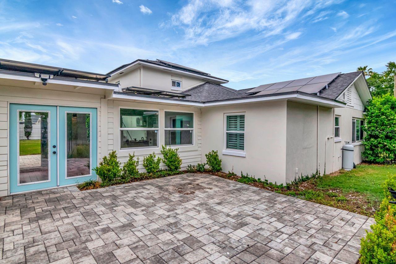 Pavered Courtyard and Side Entry to Home through Breezeway