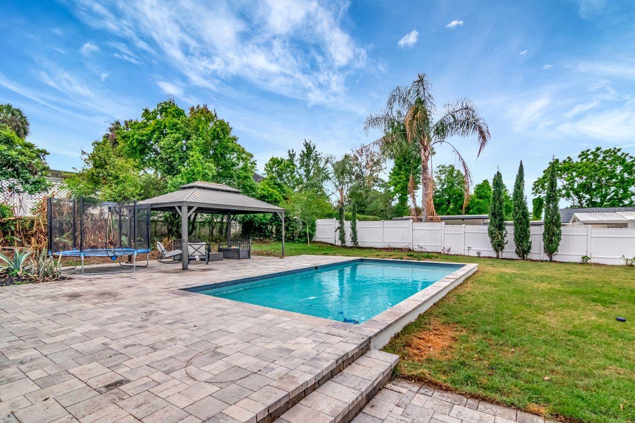 Custom Heated Salt Pool with Pavered Deck and Gazebo.