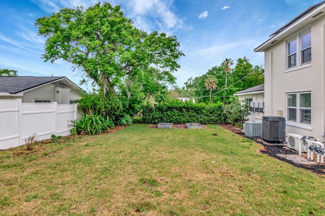 Side Yard in Backyard with Garden Bed Planter Boxes.