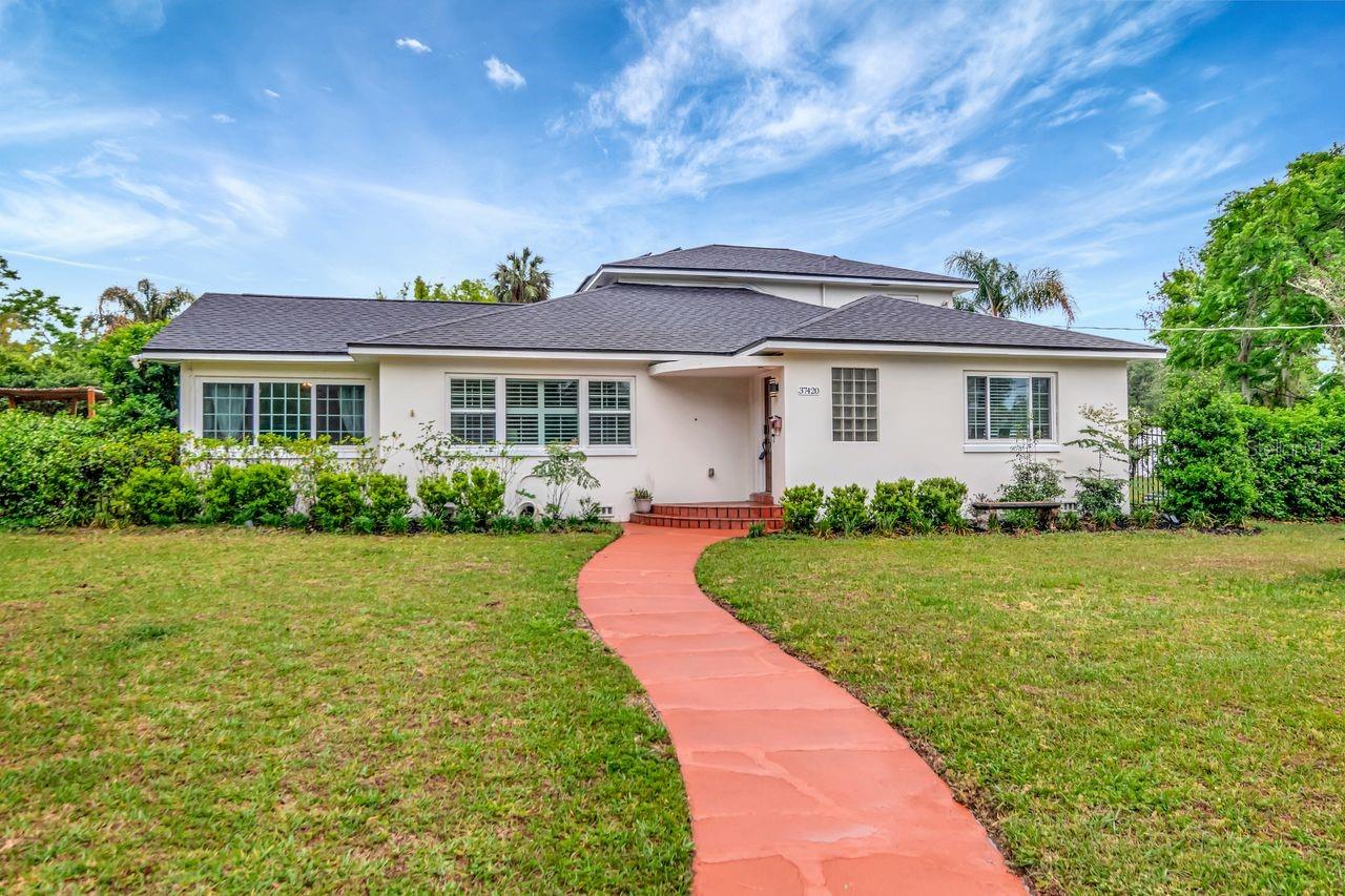 Front of Home and Walkway to Steps and Front Door with Covered Entry.