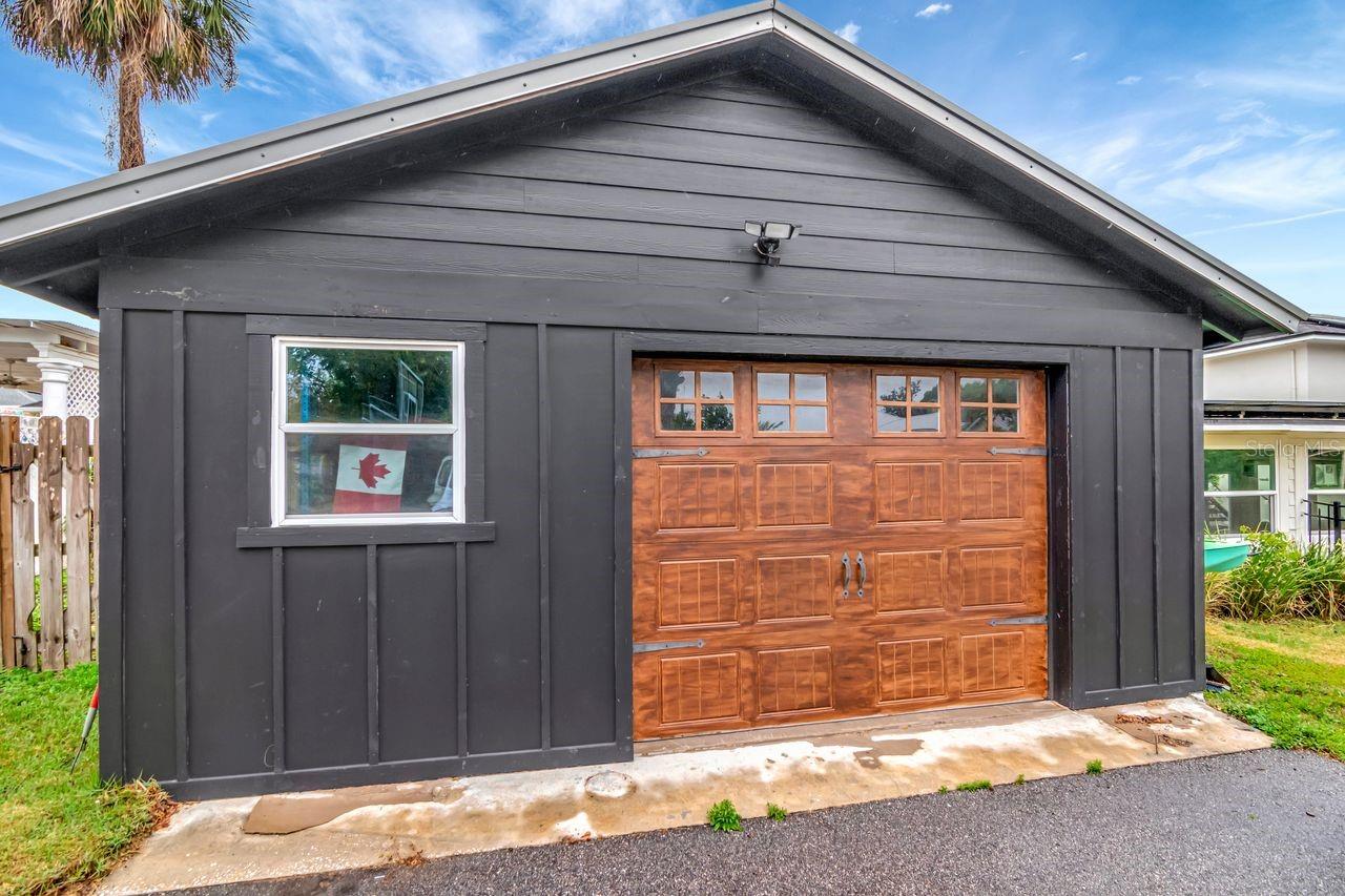 Side Entry Garage and Workshop Space off of expansive Driveway on the side of home and Long Driveway from the road.